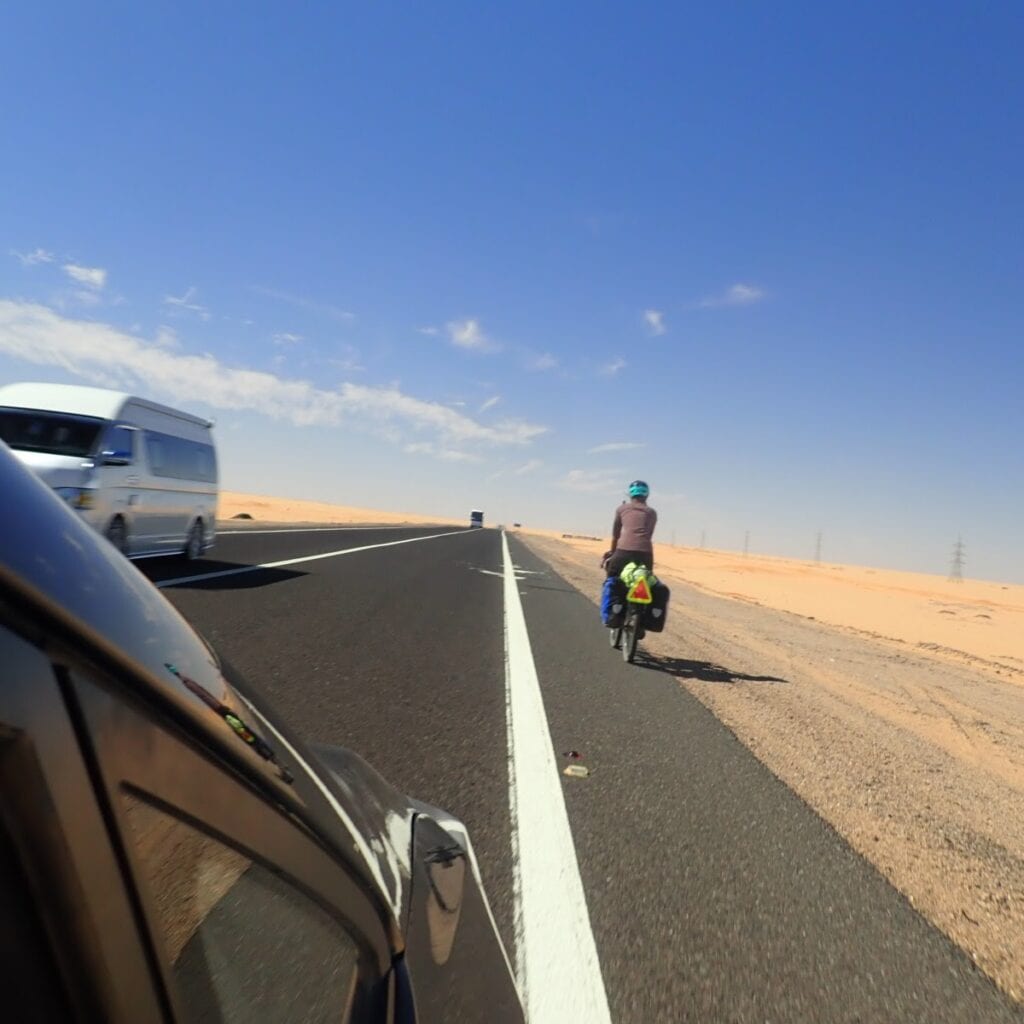 Cyclist on road in Egypt