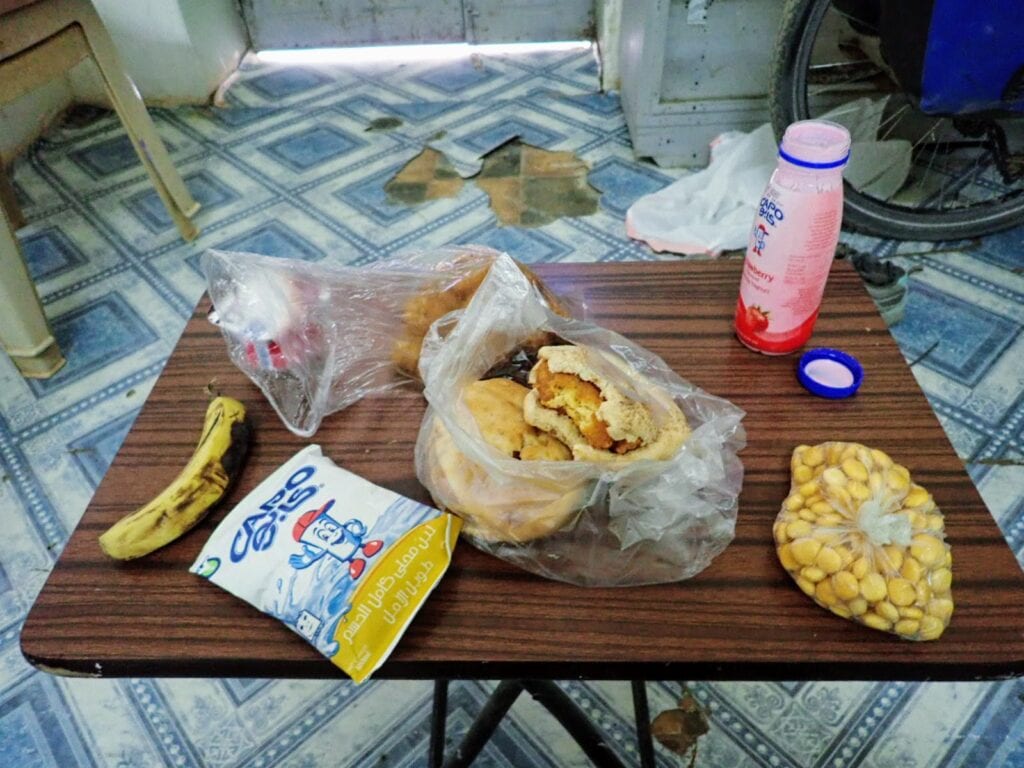 Food on table in old motel room in Dongola Sudan
