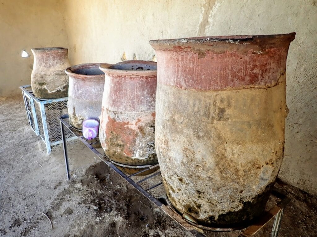 Clay water jars beside the Nile